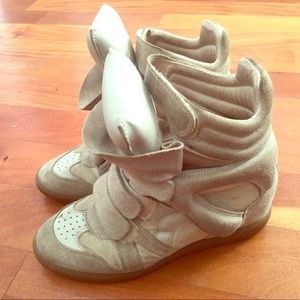 ISABEL MARRANT suede high top wedge sneakers.